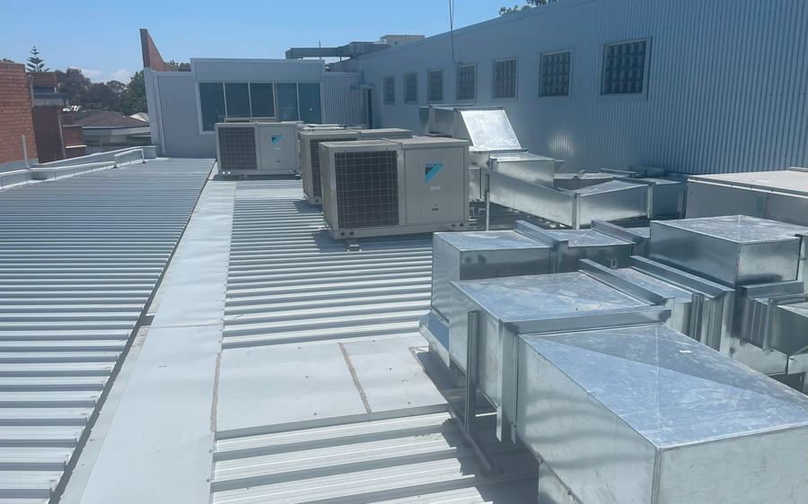 Completed commercial metal roof replacement with new plant platforms and ductwork